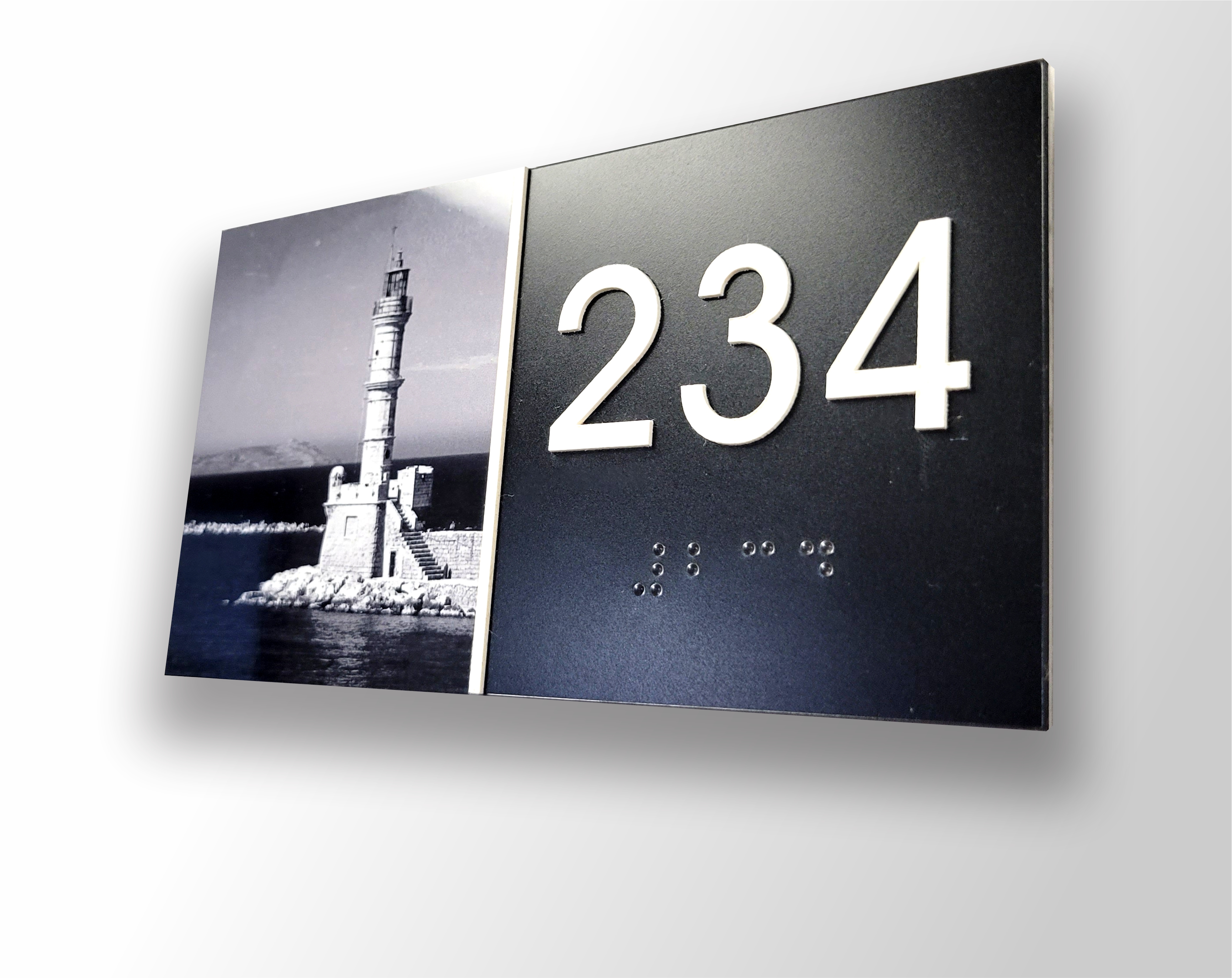 Vintage ADA braille room number sign featuring historic black and white photography
